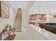 Open entryway with staircase and view of the kitchen's wooden cabinetry at 2194 Trivero St, Henderson, NV 89044