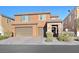Charming two-story home featuring a three car garage and landscaped front yard at 2194 Trivero St, Henderson, NV 89044