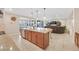 Open kitchen island with eat-in bar and stainless steel dishwasher, overlooking the living room at 2194 Trivero St, Henderson, NV 89044