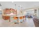A well-appointed open kitchen featuring an island with barstool seating and modern appliances at 2194 Trivero St, Henderson, NV 89044
