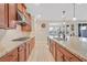 Spacious kitchen featuring modern appliances, granite countertops, and tile flooring at 2194 Trivero St, Henderson, NV 89044