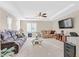 Spacious living room features comfortable seating and a ceiling fan at 2194 Trivero St, Henderson, NV 89044