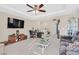 Open living room with neutral colors and a tray ceiling at 2194 Trivero St, Henderson, NV 89044