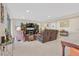 Open living room area with natural light, fireplace, and comfortable seating at 2194 Trivero St, Henderson, NV 89044