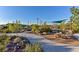 Community playground shaded by overhead sails provides a wooden picnic table and climbing structures for neighborhood children at 2194 Trivero St, Henderson, NV 89044