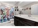 Charming bathroom featuring a double sink vanity and Marvel Comics themed shower curtain at 2531 Dollison Ave, North Las Vegas, NV 89081