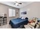 Comfortable bedroom with a full-sized bed, closet, and neutral color scheme at 2531 Dollison Ave, North Las Vegas, NV 89081