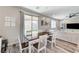 Dining area with wood-look floors, backyard access, and natural light at 2531 Dollison Ave, North Las Vegas, NV 89081