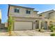 This is a charming two-story home boasting a large two car garage and concrete brick driveway at 2531 Dollison Ave, North Las Vegas, NV 89081