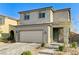 Beautiful two-story home with a two-car garage, lovely landscaping, and charming front entrance at 2531 Dollison Ave, North Las Vegas, NV 89081