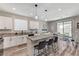 Well lit kitchen featuring granite countertops, white cabinets, and stainless steel appliances at 2531 Dollison Ave, North Las Vegas, NV 89081