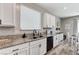 Kitchen area showcasing countertops and black appliances plus decorative accessories, and breakfast table at 2531 Dollison Ave, North Las Vegas, NV 89081