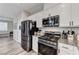 Kitchen area showcasing stainless steel appliances and granite countertops at 2531 Dollison Ave, North Las Vegas, NV 89081