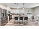 Kitchen area featuring stainless appliances, granite counters, and barstool seating at island at 2531 Dollison Ave, North Las Vegas, NV 89081