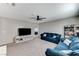 Inviting living room featuring plush couches, soft carpet, and ample space at 2531 Dollison Ave, North Las Vegas, NV 89081