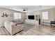Cozy living room with a large sectional couch, built-in shelves, and modern decor at 2531 Dollison Ave, North Las Vegas, NV 89081