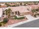 Aerial view of a desert home with terra cotta roof and well-kept landscaping at 2624 Spalding Dr, Las Vegas, NV 89134