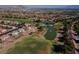 Aerial view highlights the golf course ponds surrounded by homes in this luxurious desert community at 2624 Spalding Dr, Las Vegas, NV 89134