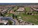 Expansive aerial view of a golf course, residential neighborhood, and a meticulously maintained landscape at 2624 Spalding Dr, Las Vegas, NV 89134