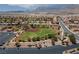 Expansive aerial view of the baseball field in a community with mountain views and a meticulously maintained landscape at 2624 Spalding Dr, Las Vegas, NV 89134