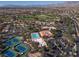 Comprehensive aerial showing tennis courts, pools, green spaces, golf and nearby residential properties at 2624 Spalding Dr, Las Vegas, NV 89134