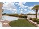 Well-manicured backyard featuring desert landscaping with a palm tree and synthetic grass at 2624 Spalding Dr, Las Vegas, NV 89134