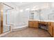 Bright bathroom with soaking tub, tile flooring, and vanity at 2624 Spalding Dr, Las Vegas, NV 89134