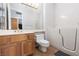 Bright bathroom features walk-in tub, wood vanity, and neutral tile flooring at 2624 Spalding Dr, Las Vegas, NV 89134
