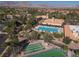 Resort-style pool and amenity area with palm trees and lush landscaping for relaxation and leisure at 2624 Spalding Dr, Las Vegas, NV 89134
