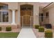 Inviting entryway featuring double doors, columns, and a secure front gate at 2624 Spalding Dr, Las Vegas, NV 89134