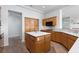 Gourmet kitchen with a large island and white countertops, featuring ample oak cabinetry for storage at 2624 Spalding Dr, Las Vegas, NV 89134