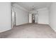 Large main bedroom with carpet, trey ceiling, and multiple entry doors at 2624 Spalding Dr, Las Vegas, NV 89134