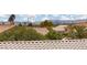 View of neighborhood tile roofs and the city skyline in the distance at 2624 Spalding Dr, Las Vegas, NV 89134