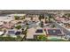 Extensive aerial view of a community featuring single Gathering homes, many with solar panels installed, in a desert landscape at 2707 Wild Breeze Ct, North Las Vegas, NV 89031