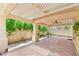 Inviting covered patio featuring stylish tile flooring, a ceiling fan, and views of the lush backyard at 2707 Wild Breeze Ct, North Las Vegas, NV 89031