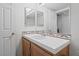 Bathroom featuring a large vanity with double mirrors and white tile countertop at 2707 Wild Breeze Ct, North Las Vegas, NV 89031