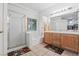 Bright bathroom with double vanity, bathtub, and glass door shower at 2707 Wild Breeze Ct, North Las Vegas, NV 89031