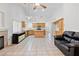 Spacious living room with a fireplace and view of the kitchen at 2707 Wild Breeze Ct, North Las Vegas, NV 89031