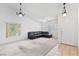 Spacious living room with carpet and a vaulted ceiling, bathed in natural light from the large windows at 2707 Wild Breeze Ct, North Las Vegas, NV 89031