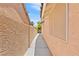 Narrow side yard showing exterior siding at 2707 Wild Breeze Ct, North Las Vegas, NV 89031