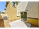 The backyard features a small patio, rock landscaping, and a sliding door at 2747 Tahiti Grape Way # 2, Las Vegas, NV 89183