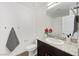 This bathroom features granite counters, a mirror, and towel racks at 2747 Tahiti Grape Way # 2, Las Vegas, NV 89183