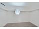Walk-in closet featuring carpeted flooring, white walls, and hanging rods for organization at 2747 Tahiti Grape Way # 2, Las Vegas, NV 89183