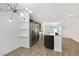 Modern kitchen featuring stainless steel appliances, dark cabinets, an island, and an open concept to dining area at 2747 Tahiti Grape Way # 2, Las Vegas, NV 89183