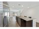 Bright kitchen with a granite island, stainless steel appliances, and an open floor plan leading to the living space at 2747 Tahiti Grape Way # 2, Las Vegas, NV 89183