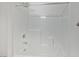 A bright white shower features a tiled wall and a rain shower head at 2747 Tahiti Grape Way # 2, Las Vegas, NV 89183