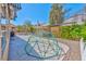 Spacious backyard featuring a concrete patio, play structure, and a storage shed for outdoor activities at 3525 Dover Bay St, Las Vegas, NV 89129