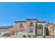 Charming two-story home featuring a well-maintained front yard and an attached two-car garage at 3525 Dover Bay St, Las Vegas, NV 89129