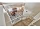 Open view of the living room and dining area below from the top of the staircase at 3525 Dover Bay St, Las Vegas, NV 89129