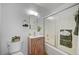 Bathroom featuring a vanity, toilet, and shower with a glass door at 4047 Maple Hill Rd, Las Vegas, NV 89115